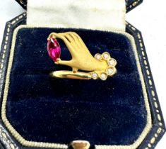 18ct gold hand ring set with red & white gemstones weight 2.9g has been xrt tested as 18ct gold