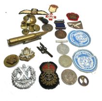 selection of military items inc bullet lighter cap badges buttons patches etc