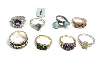 Selection of 8 silver gemstone set rings