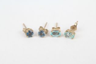 2 x 9ct gold blue gemstone and topaz stud earrings