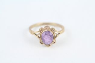 9ct gold oval cut amethyst single stone ring with wavy openwork frame