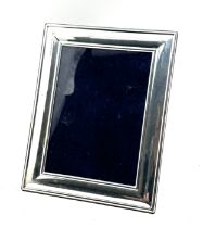 Silver picture frame measures approx 22cm by 17cm