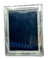 Vintage silver picture frame measures approx 22 cm by 17cm