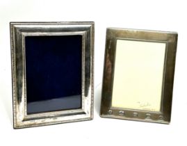 2 silver picture frames largest measures approx 18cm by 14cm