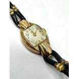 Vintage 9ct gold ladies rolex tudor wristwatch with black leather strap the watch winds and ticks