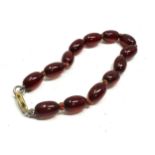 9ct gold clasp cherry amber / bakelite bead bracelet weight approx 7g internal streaking to beads