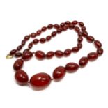 Antique cherry amber / bakelite bead necklace with internal streaking weight 60g 9ct gold clasp
