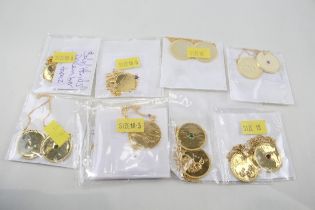A collection of gold tone silver zodiac necklaces (94g)