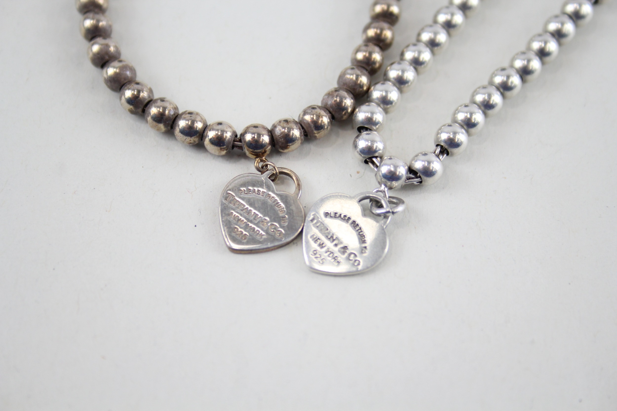 Two silver bracelets with enamel heart charms by designer Tiffany & Co (11g) - Image 7 of 7