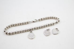 Silver bracelet and pendants/charms by designer Tiffany & Co (7g)