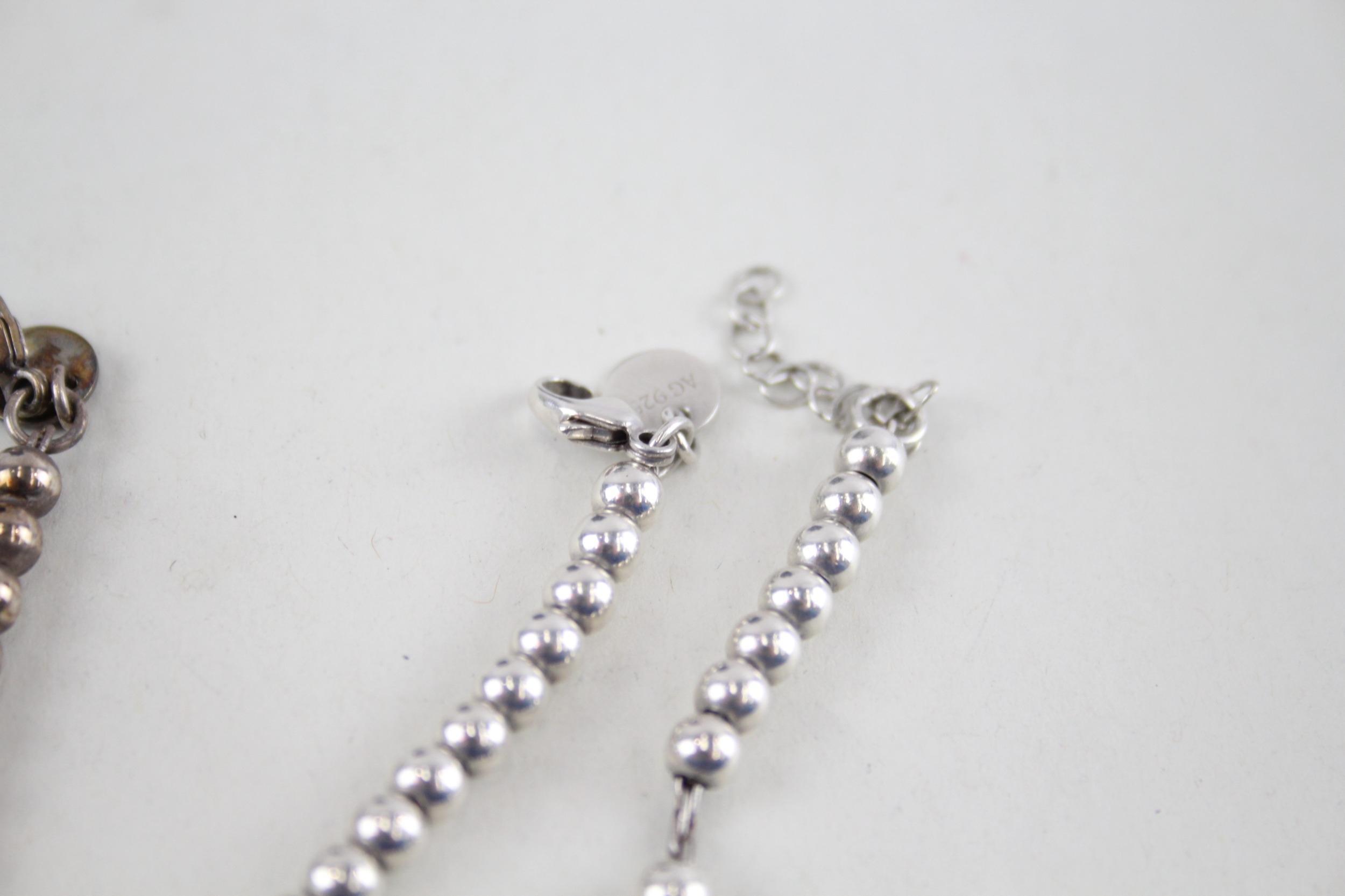 Two silver bracelets with enamel heart charms by designer Tiffany & Co (11g) - Image 5 of 7
