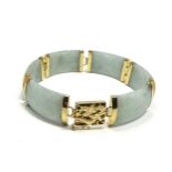 Chinese 14ct gold & jade bracelet jade panels with 14ct gold mounts clasp has dragen details