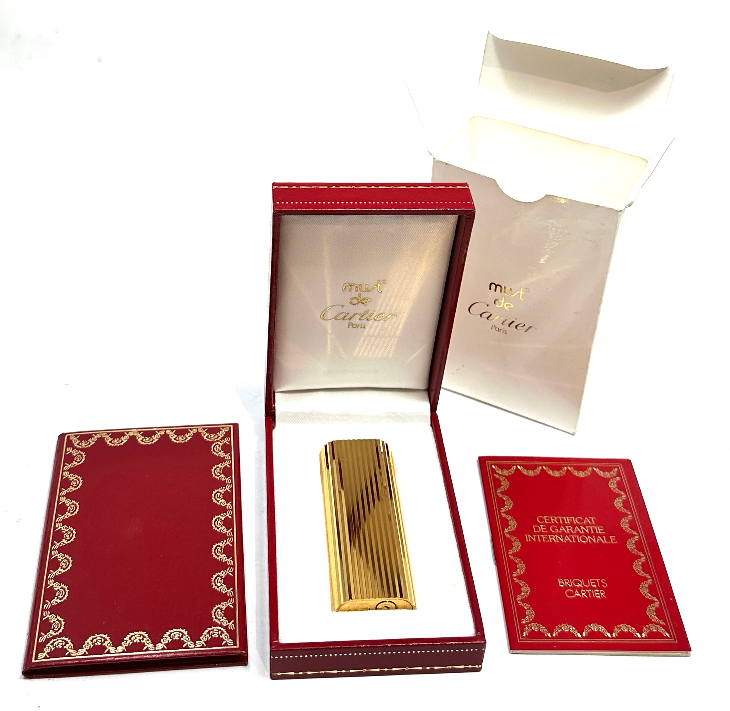 Original boxed Cartier cigarette lighter in as new condition complete with boxes and booklet