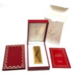 Original boxed Cartier cigarette lighter in as new condition complete with boxes and booklet