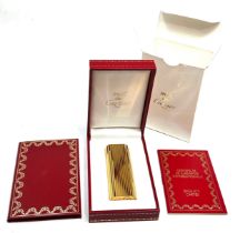 Original boxed Cartier cigarette lighter in as new condition complete with boxes and booklet