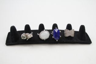 Four silver gemstone rings including Moonstone (34g)