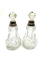 Pair of antique hallmarked silver mounted perfume bottles each measure approx height 14cm london