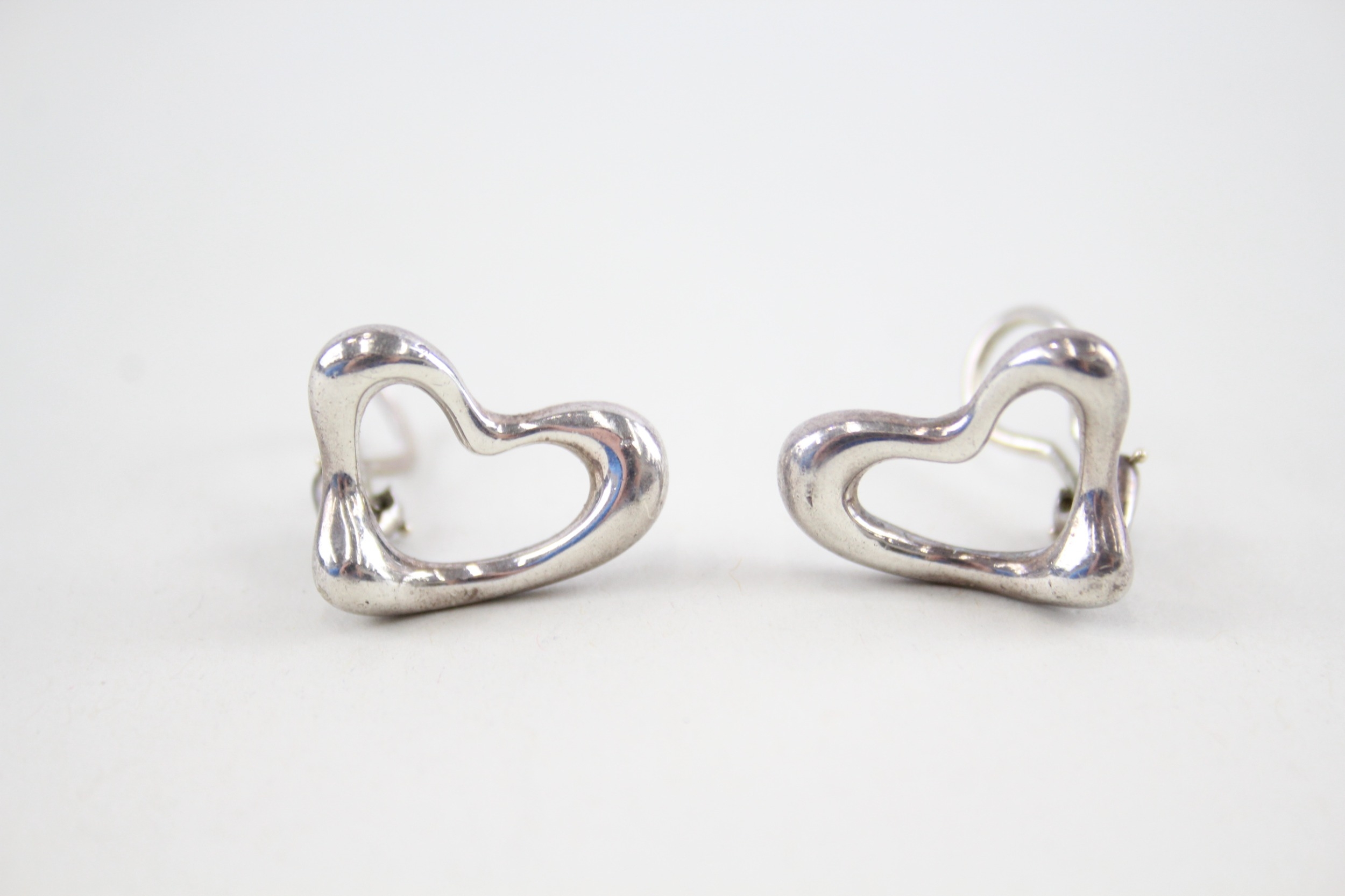 Pair of silver heart clip on earrings by designer Tiffany & Co (9g)