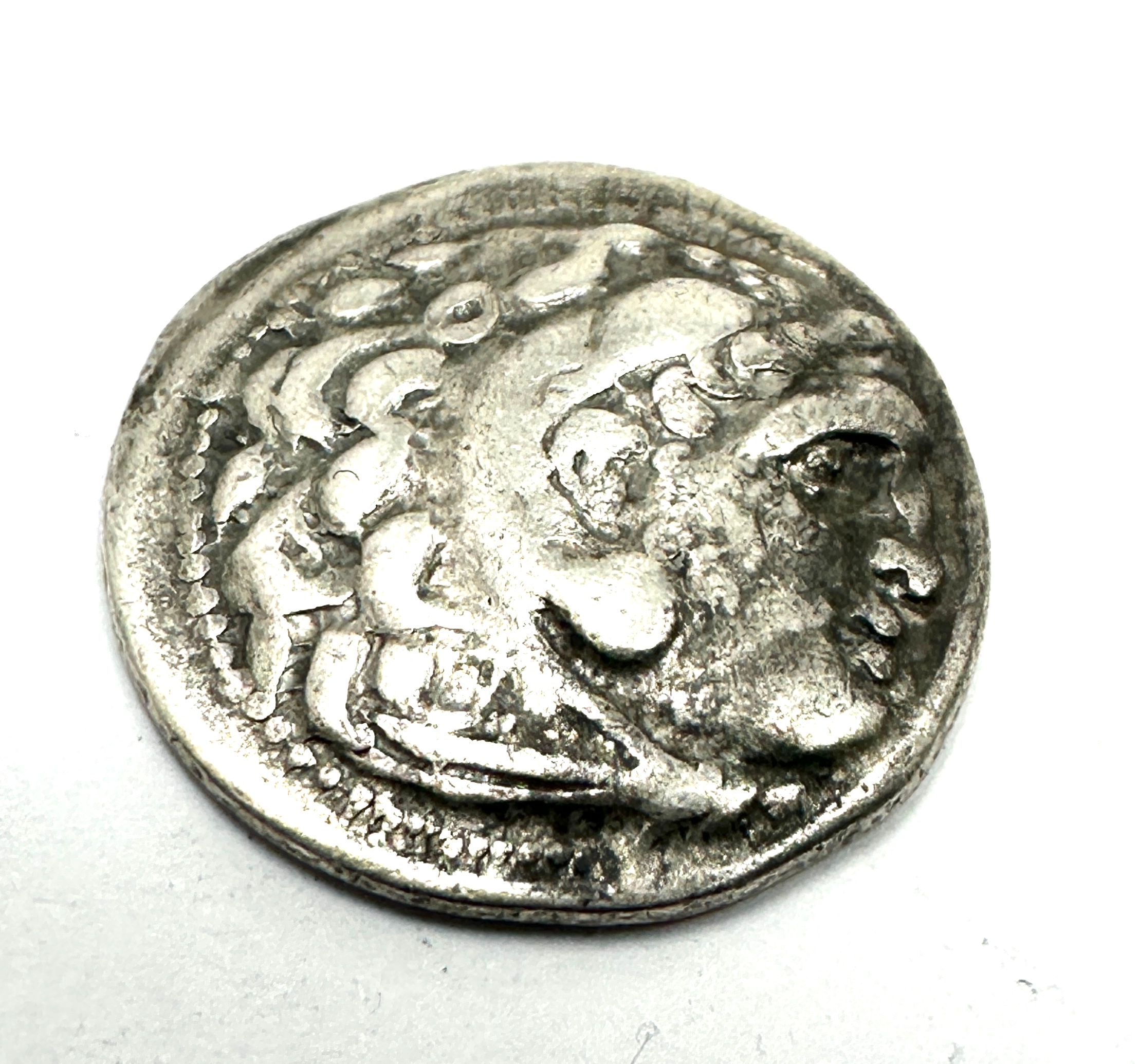 Silver drachm coin minted by Alexander the Great (336-323 BC). Obverse: Alexander as Herakles