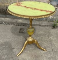 Brass and faux onyx occasional table measures approx 22 inches tall, 19 diameter