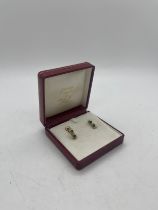 Pair of 18ct diamond and emerald earrings 2.9 grams