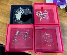 Selection of four boxed Butler and Wilson brooches