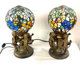 Cherub base lamps, with sphere glass shades, working order, overall height 17 inches