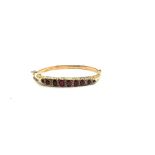 9ct gold garnet and ladies bangle 9.3 grams Birmingham 1907 hallmark