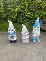 Three plastic garden gnome figures height 36 inches
