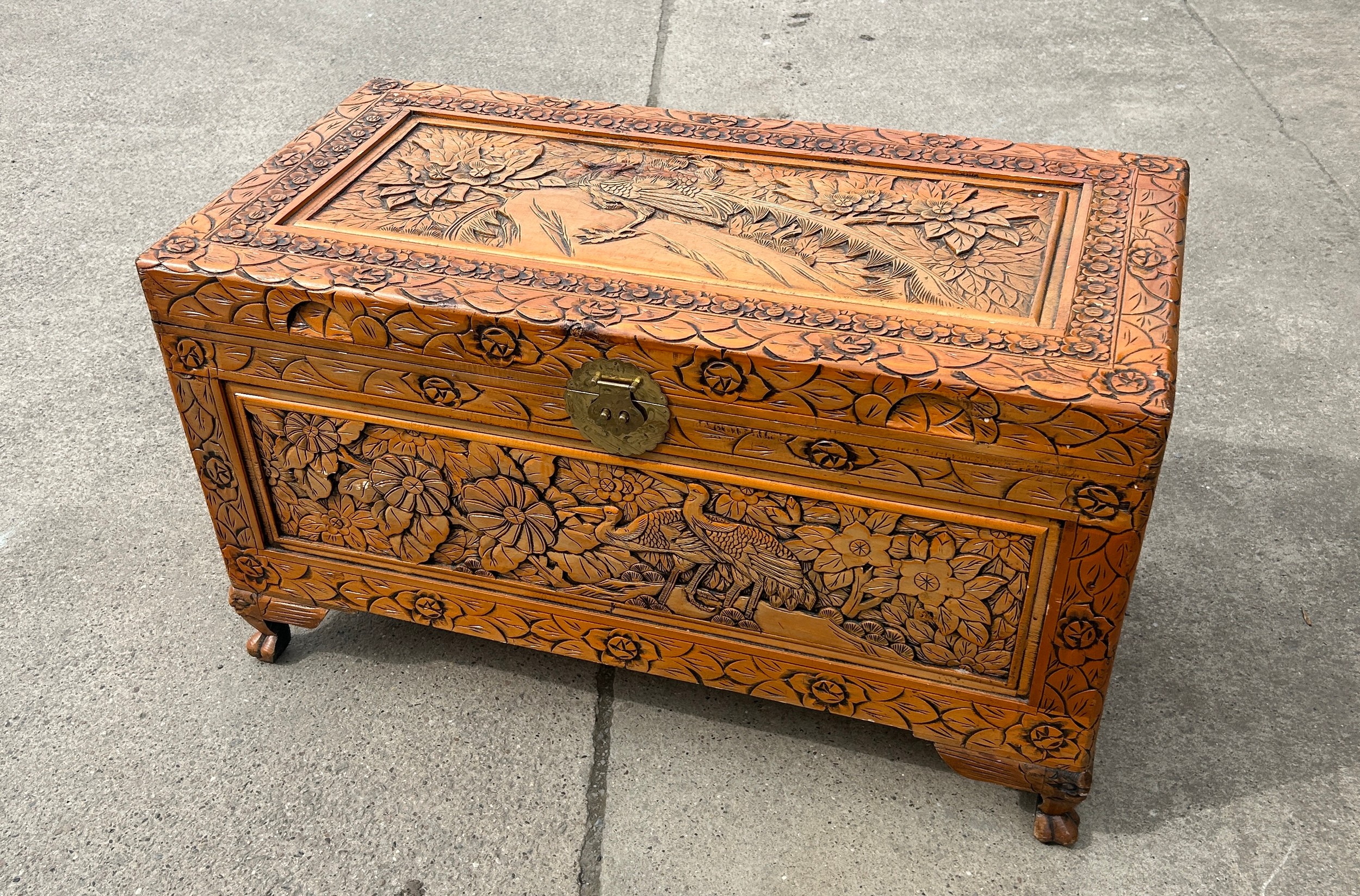 Carved oriental blanket box measures approx 23 inches tall, 40 wide and 21 deep