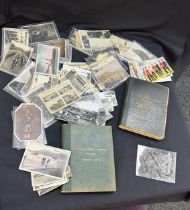 Selection of vintage postcards and vintage college education books