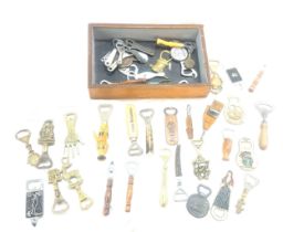 Large selection of vintage Novelty bottle openers in a display case/ drawer
