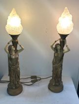 Pair gold lady with flame shaped table lamps, working order, overall height 28 inches