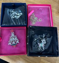 Selection of four boxed Butler and Wilson brooches