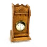 Vintage silver pocket watch in a wooden desk stand