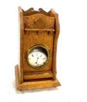 Vintage silver pocket watch in a wooden desk stand