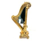 Gilt harp shaped cherub table mirror, overall height 24 inches