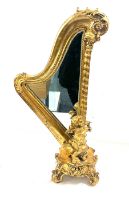 Gilt harp shaped cherub table mirror, overall height 24 inches