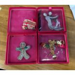 Selection of four boxed Butler and Wilson brooches