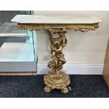 Gold cherub console table, marble effect top, approximate measurements: Height 32 inches, Width 33