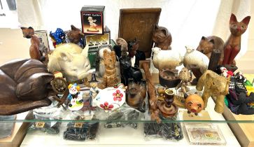 Selection of wooden cat ornaments, various animal pot pieces, and clowns