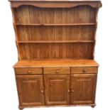 Pine three door three drawer dresser measures approx 51 inches tall by 56 inches wide and 15 deep