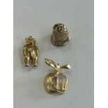 2 9ct gold charms ( teddy and a bell), 14ct gold New York apple charm