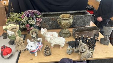 Large selection of garden ornaments includes planters, dog figures, gnome etc