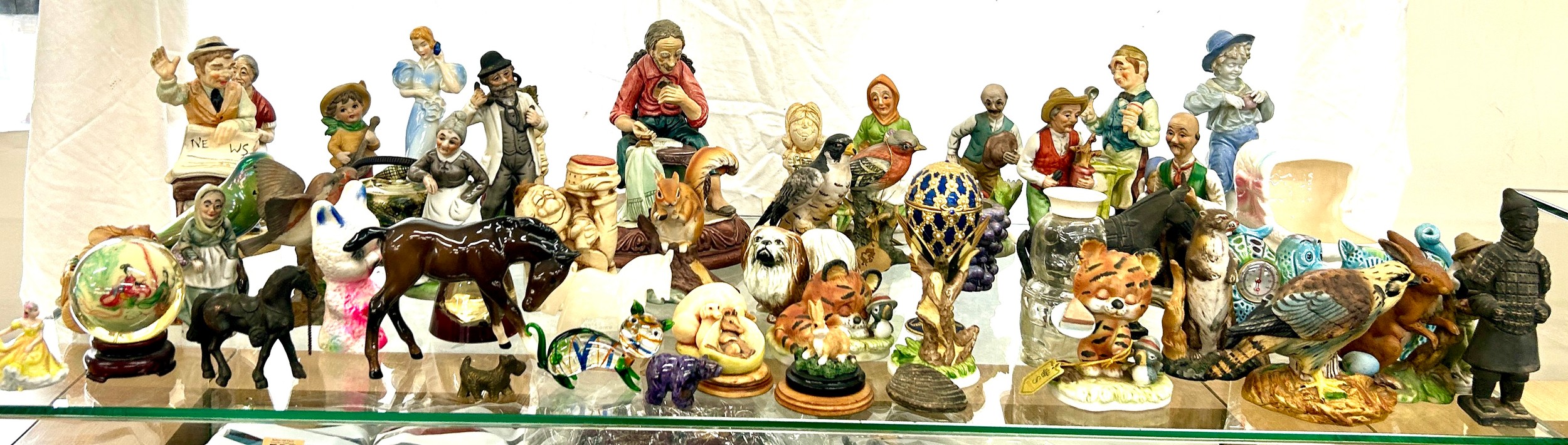 Large selection of collectables ornaments to include a Beswick horse, miniature Doulton lady,