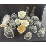 Selection of glass and porcelain jelly moulds to include pyrex etc