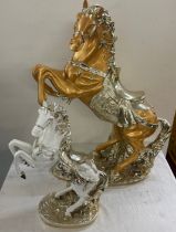 2 Decorative large plastic ornamental horses, largest measures approximately Height 27 inches, Width