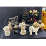 Selection of porcelain, wooden and resin animals, to include frog, dolphins crowned bulldog etc (