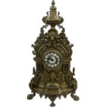 Ornate French brass mantel clock with enamel face, with key, depicting cherubs, Height 24 inches,