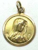 18k gold religious pendant, approximate weight 1.6g, unmarked but tested as 18k
